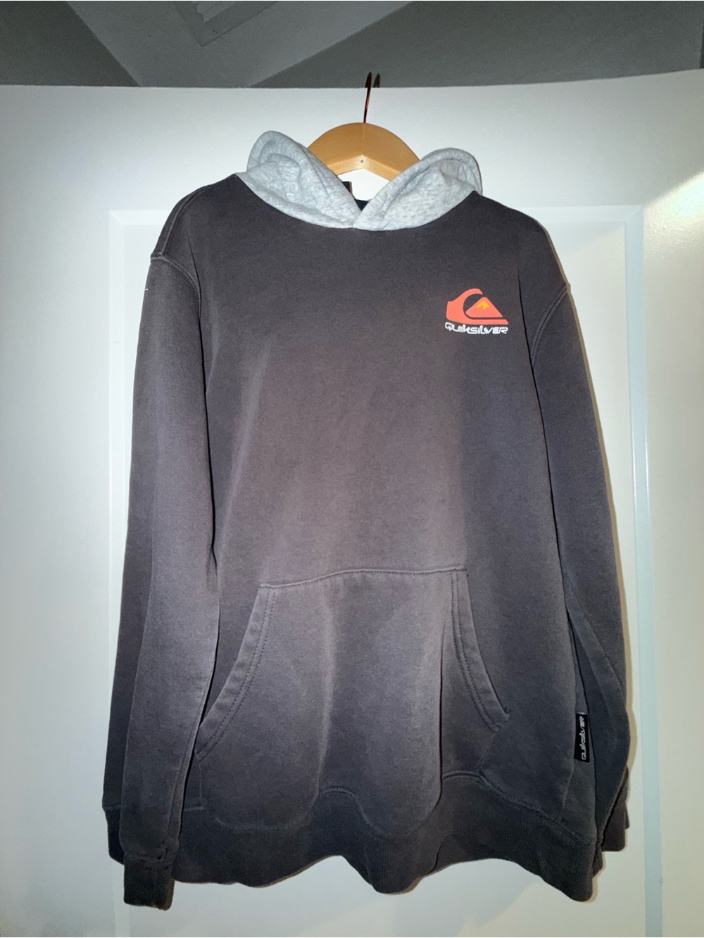 Vintage Quicksilver Black Pullover Hoodie with Grey Lined Hood and Orange Logo